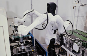 Agibot humanoid robot in an assembly workcell.