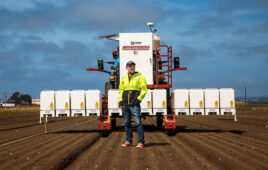 Carbon Robotics Founder and CEO Paul Mikesell with the company's LaserWeeder G2.