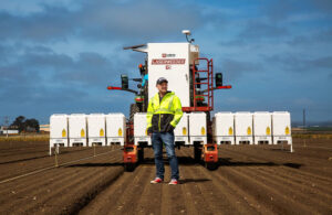 Carbon Robotics Founder and CEO Paul Mikesell with the company's LaserWeeder G2.