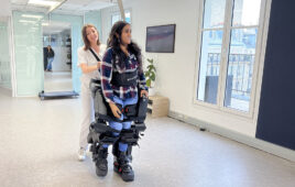 A person walking with a Wandercraft exoskeleton.