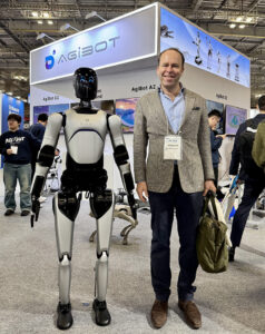 Georg Stieler with AgiBot's humanoid at iREX 2025.