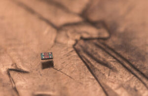 A microrobot on a U.S. penny, showing scale.