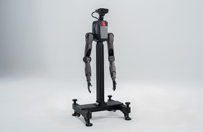 um TRON 2 de braço duplo montado em um suporte vertical estacionário.