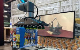 A Robotiq gripper and a Universal Robots arm holding a box of chips or crisps for palletizing.