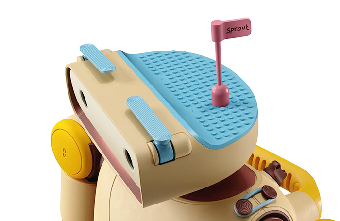 close up showing the LEGO grid on the top of sprout's head.