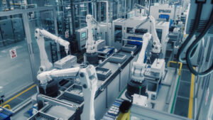 Robot arms working a machine tending task.