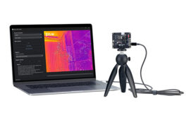camera on a tripod with image on a laptop.