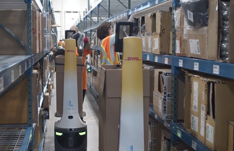DHL Supply Chain’s employees working alongside Locus Origin autonomous mobile robots. 