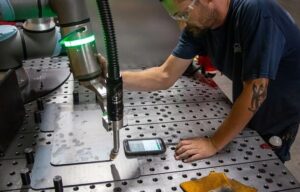 Force- and power-limited robots such as those from UR enable humans to work alongside robots for tasks such as welding, shown here.