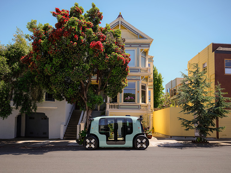 a zoox robotaxi parked on the street in san francisco.