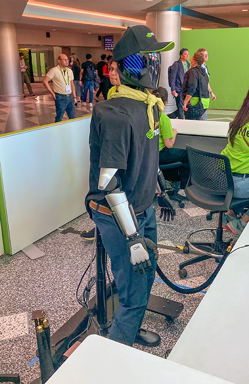 Full length image of the Intbot robot showing its feet and stand.