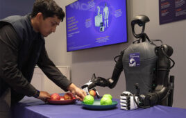 A humanoid robot demonstrates grasping using the Qualcomm Dragonwing IQ10 series platform.