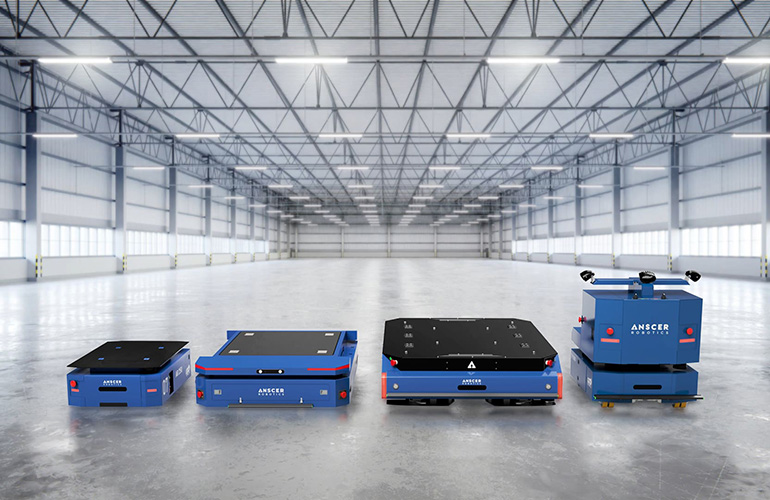 lineup of ANSCER robots in an empty warehouse building.