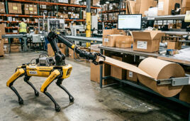 ai generated image of a quadruped robot pulling packing paper off a roll at the end of a warehouse packout station.
