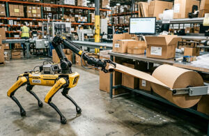 ai generated image of a quadruped robot pulling packing paper off a roll at the end of a warehouse packout station.