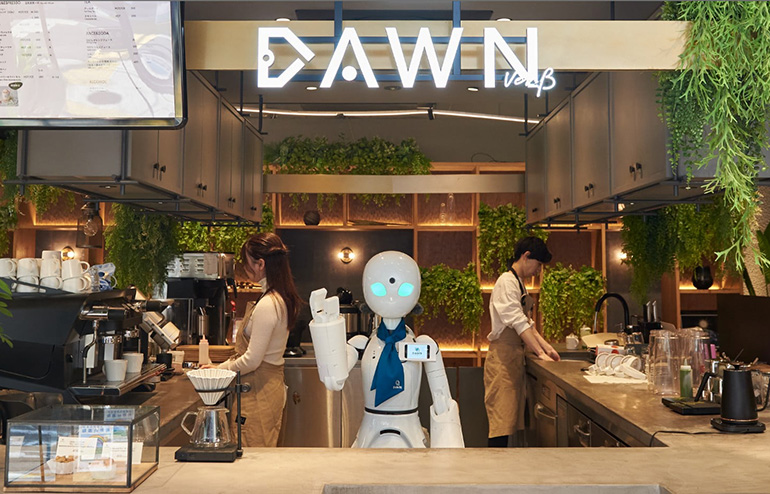 The Dawn cafe, in which people with disabilities teleoperate robots, shows the possibility of human-robot collaboration across manufacturing and other industries.