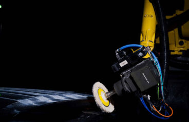 A GrayMatter Robotics robot buffing a part.