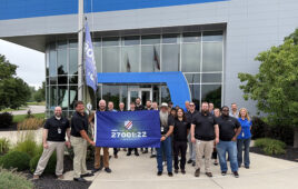 Yaskawa America's team celebrates its international information security certification.
