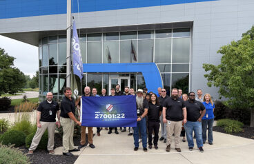 Yaskawa America's team celebrates its international information security certification.