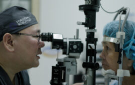 Dr. Robert Ang, the study's principal investigator, performing a post-op patient exam. | Source: ForSight Robotics