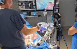 operating room with a humanoid robot and a surgeon.
