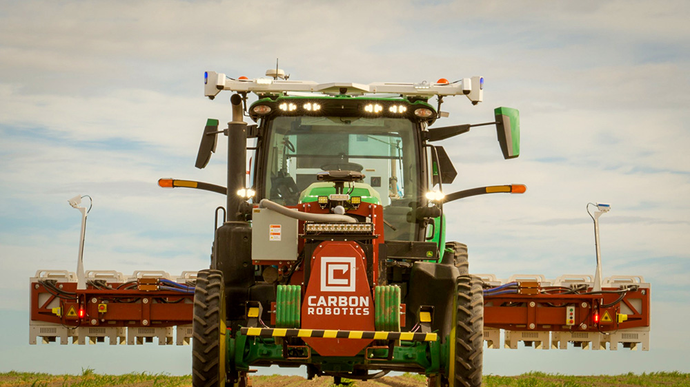 hero image of a John Deere tractor equipped with Carbon ATK.