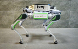 side view of a quadruped robot with backpack.