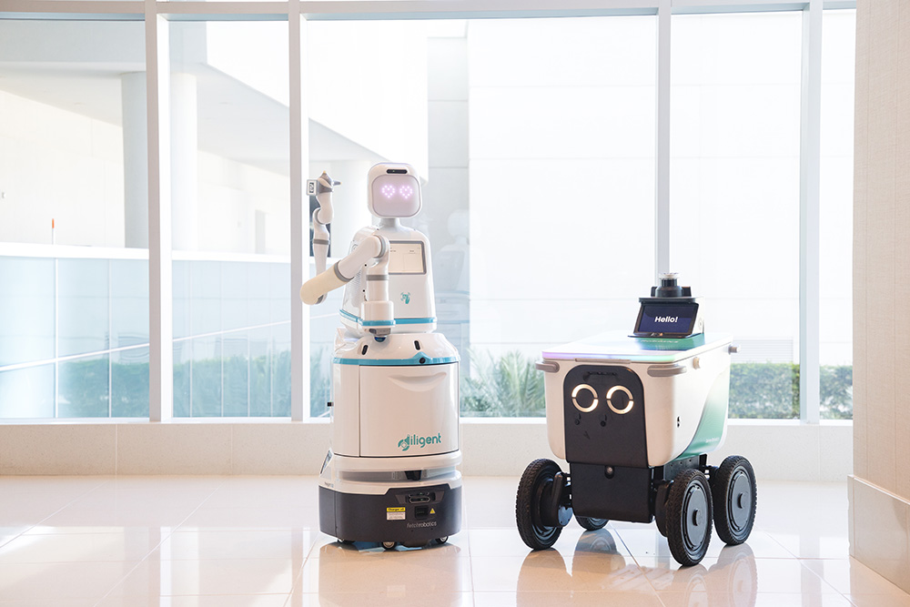 Diligent's Moxie robot and Serve's sidewalk delivery robot.