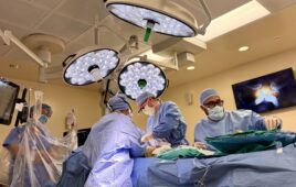 Surgery, sown here with the assistance of a da Vinci surgical robot, is one of two topics in this month's digital issue.