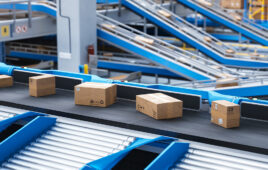 Packages moving along a conveyor belt.