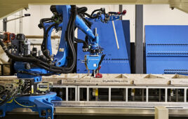 A robot arm assembling a house component. Promise Robotics says it can accelerate homebuilding by standardizing component manufacturing.
