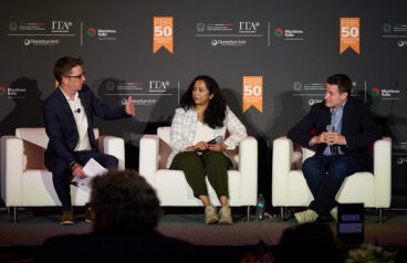 Aaron Parness, director of applied sciences at Amazon Robotics, and Bhavana Chandrashekhar, the senior manager of applied science at Amazon Robotics, speaking at the 2026 RBR50 gala.