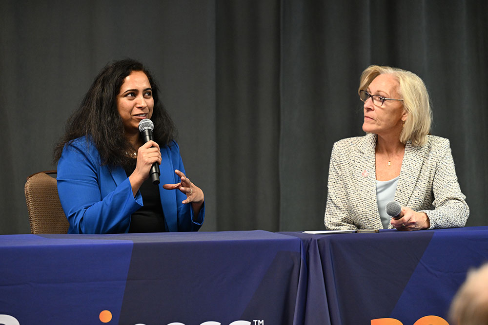 Bhavana Chandrashekhar and Joyce Sidopoulos on stage.