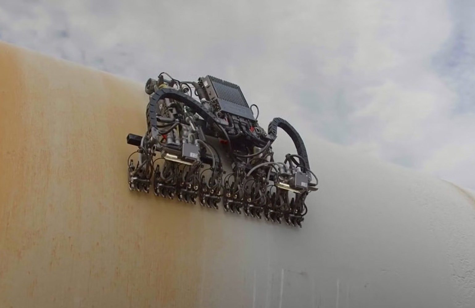 Gecko Robotics' robot crawling on a large object.
